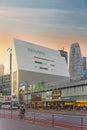 Shinjuku Mylord shopping mall at Shinjuku Station with the HAL Tokyo building at sunset.